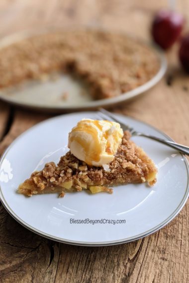 Focused image of individual serving of Caramel Apple Pecan Dessert Pizza