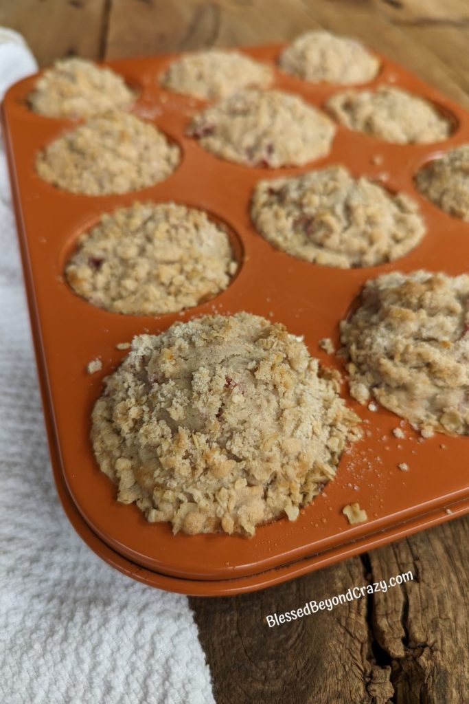 Close up view of Raspberry Streusel Muffins cooling in pan