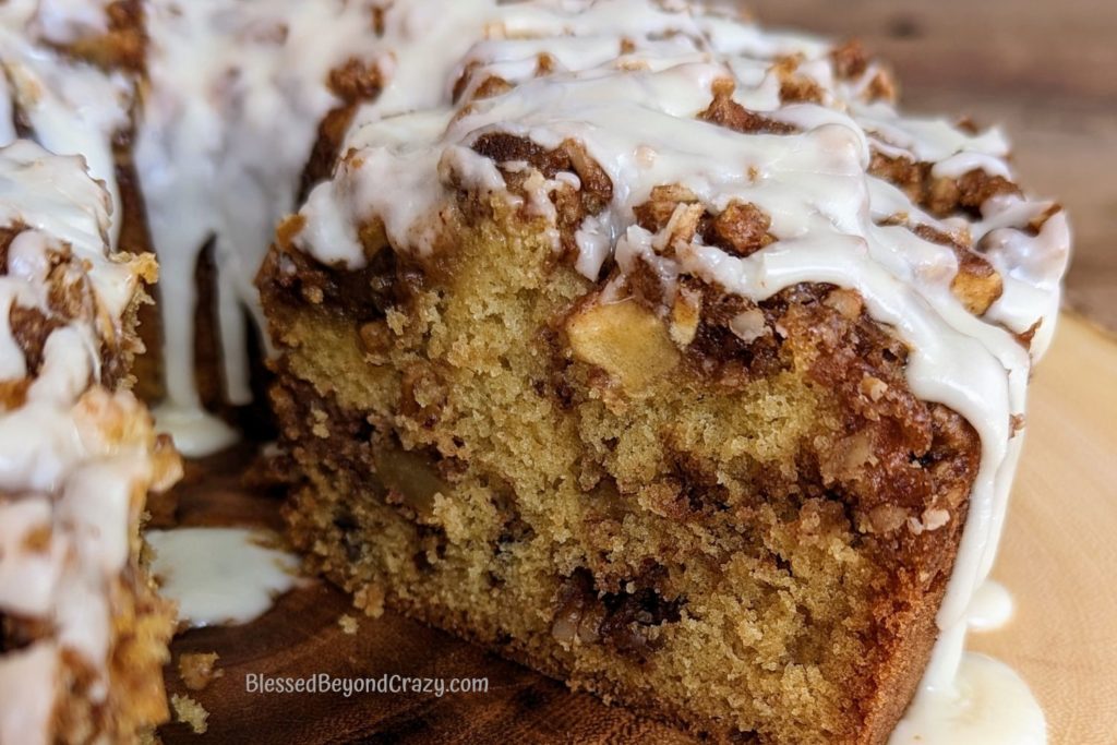 Close up photo of center of apple streusel cake after one serving was removed.