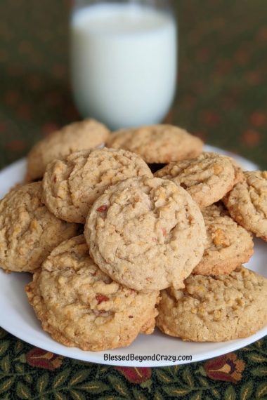 Plate of cereal jumble cookies with glass of cold milk