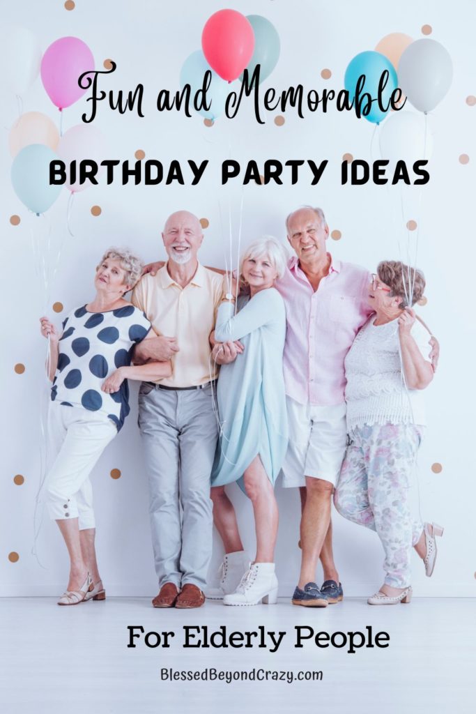 Group of happy elderly men and women holding balloons and celebrating