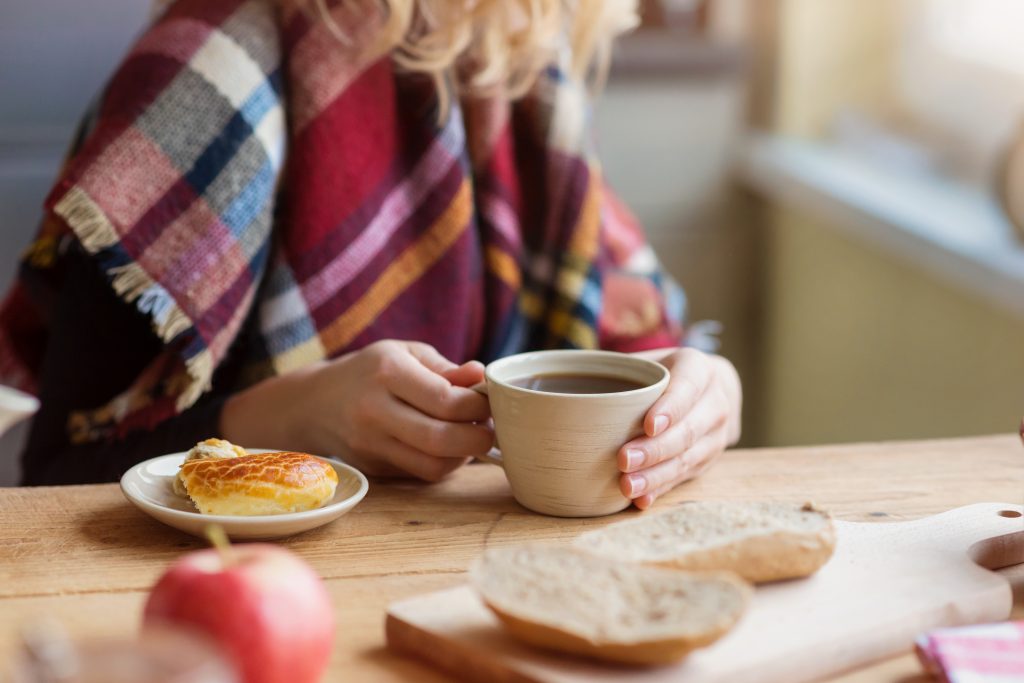 Women enjoying a cup of hot coffee