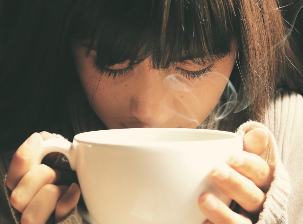 Steamy cup of coffee in a gourmet coffee shop